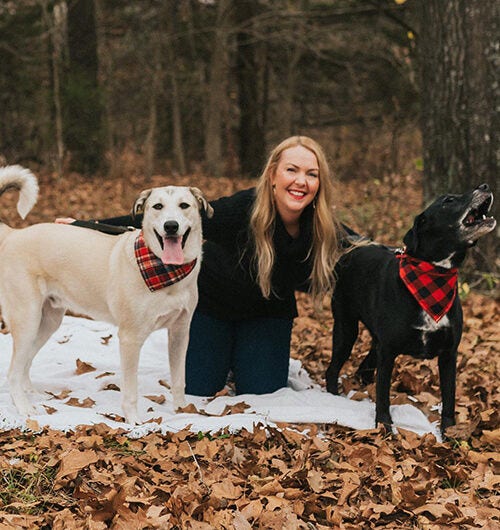 Ashley Lewis with her two dogs
