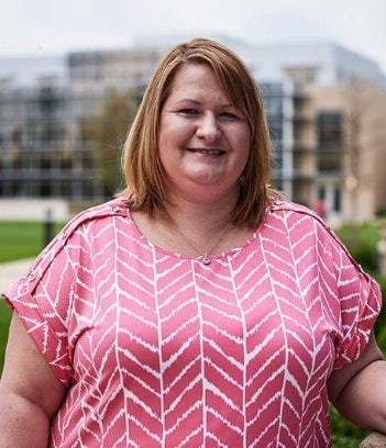 Deborah Askey standing in front of Maryville University